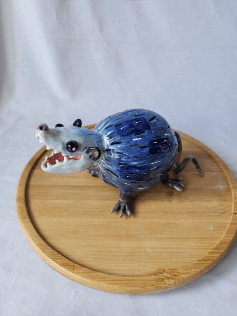 Ceramic opossum lamp